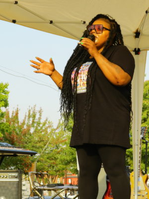 Lisa speaking on stage at an event