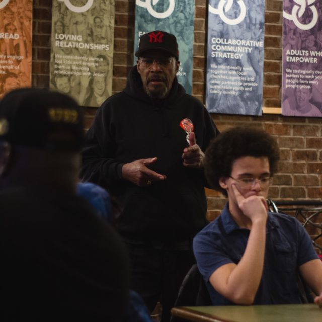Dr. Woods speaks to a group at an event
