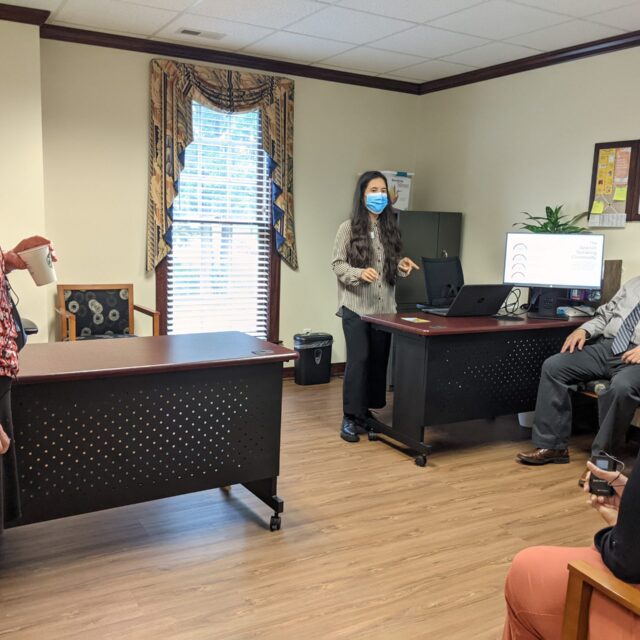 Tomiko speaks to a group of people at the Latinos in Virginia Empowerment Center