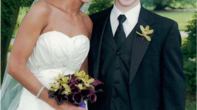 Adriana smiles on her wedding day with her brother Luc