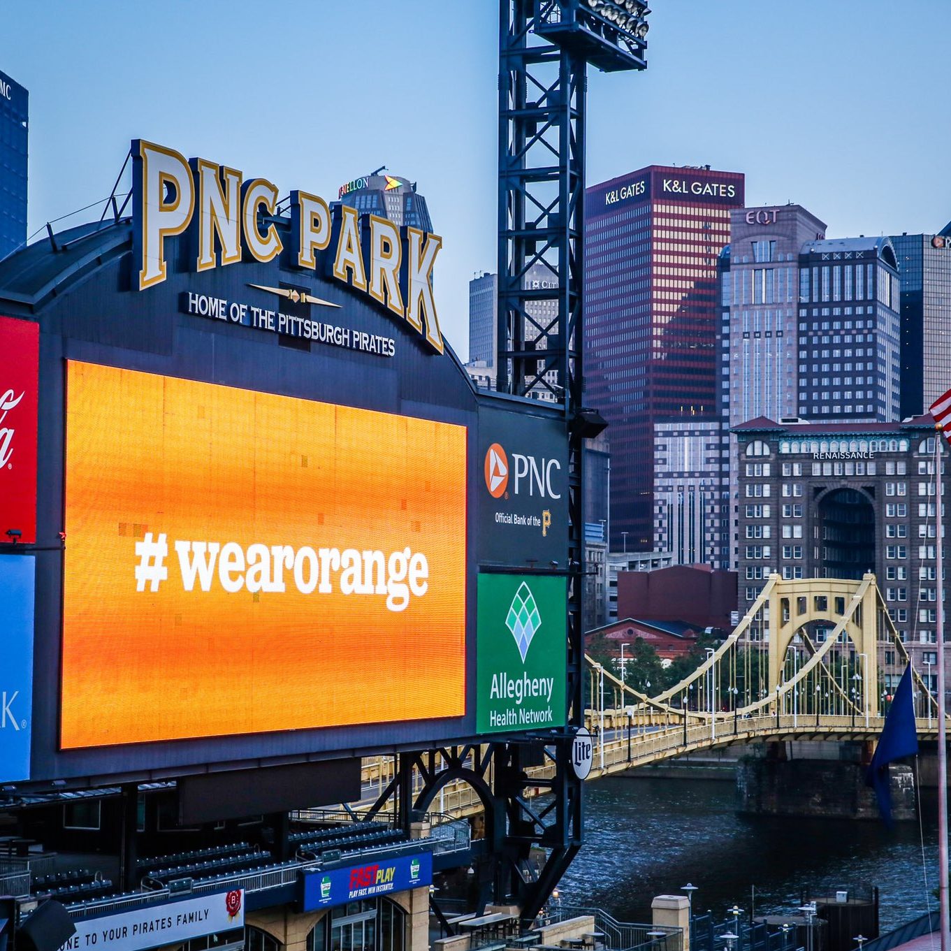 The Pittsburgh Pirates baseball team showcases a Wear Orange sign on their video screen