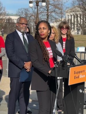 Angela Ferrell-Zabala stands behind a podium on Capitol Hill