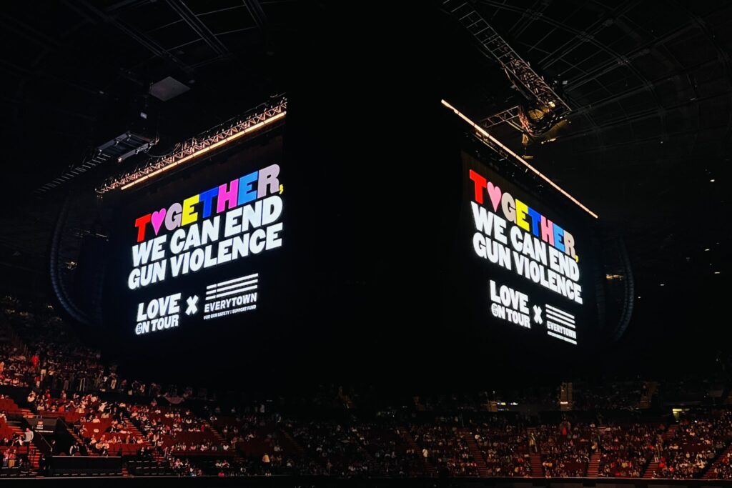 Jumbotron at Harry Styles concert that says “Together, we can end gun violence”