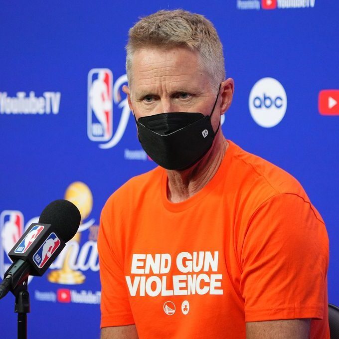 Steve Kerr wearing an orange End Gun Violence t-shirt