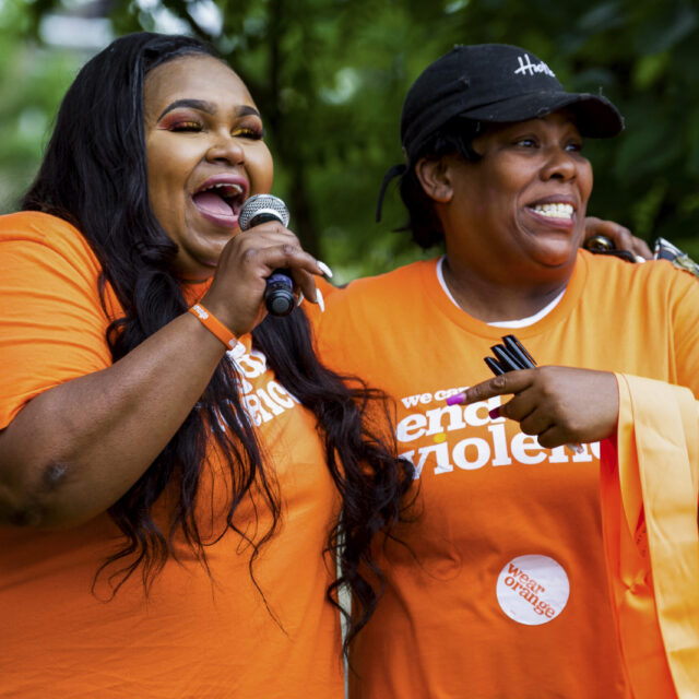 Two people wearing Wear Orange t-shirts