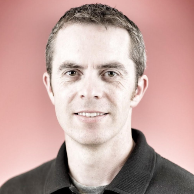 Image of Sean Horgan, a U.S. Marine Corps veteran. Sean, a white male with short brown hair and a black collared shirt.
