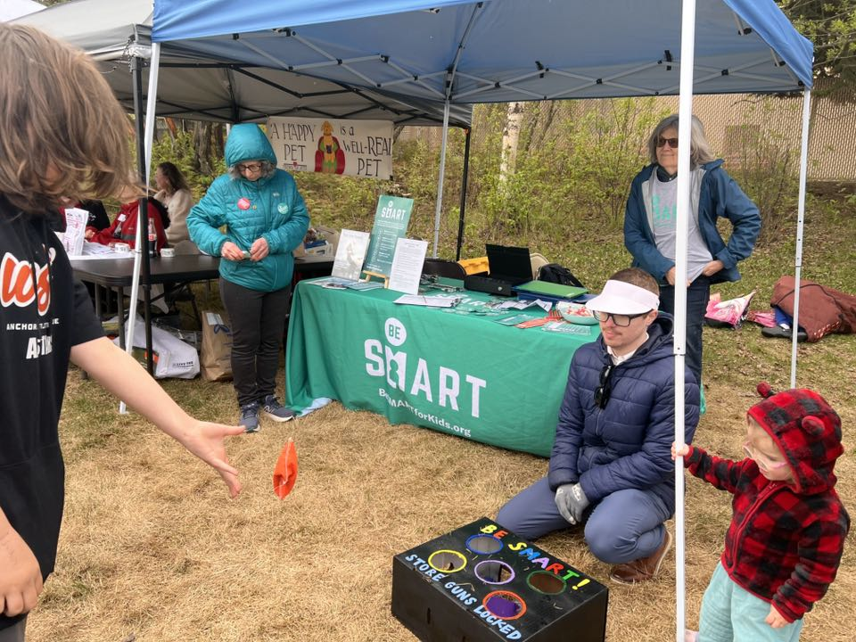 Alaska Moms Demand Action volunteers table at a community event.